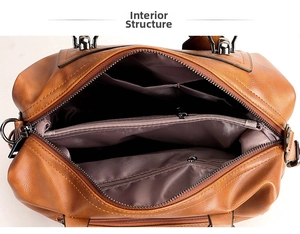 Detailed internal view of vintage brown PU leather bag with multi-compartment storage