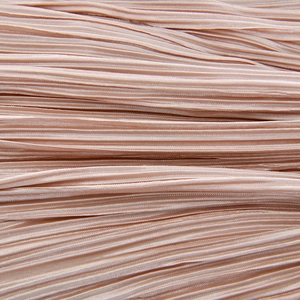 Detailed macro view of the pleated light pink fabric showing fine texture and glossy finish