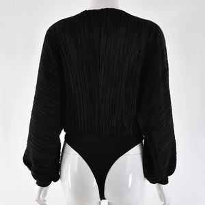 Rear view of black long sleeve pleated bodysuit with thong cut on a white mannequin