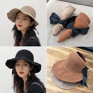 Foldable wide-brim straw sun hat with black bow detail, available in multiple colors