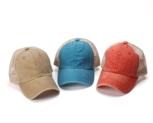 Three washed cotton trucker hats in khaki, teal, and coral with breathable mesh back