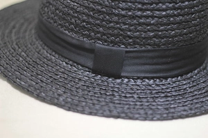 Elegant black raffia fedora hat for women with satin ribbon and fine woven texture