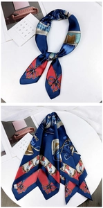 Detailed view of square silk scarf featuring equestrian prints and decorative patterns