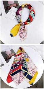 Detailed view of colorful satin silk scarf with abstract geometric and pop art prints