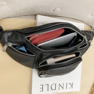 Chic black leather waist bag with multiple zipper compartments for phone and wallet
