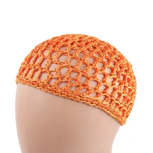 Detail of orange handmade crochet hair net with large hollow mesh and bow accent