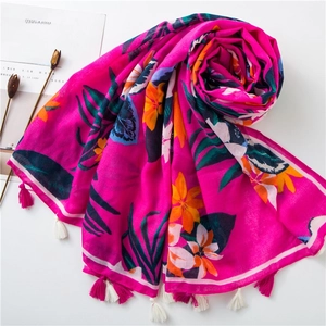 Vibrant rose red cotton linen scarf with tropical floral prints and colorful tassels