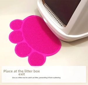 Detail of rose red PVC paw-shaped litter mat featuring anti-slip texture and sand trapping