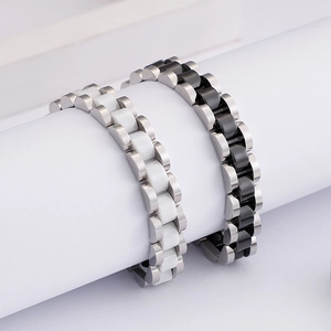 Polished ceramic and stainless steel watchband style bracelets in black and white
