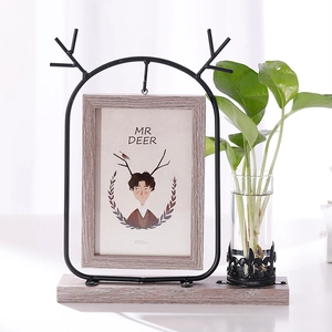Nordic black deer antler iron photo frame with a glass hydroponic vase and wooden base