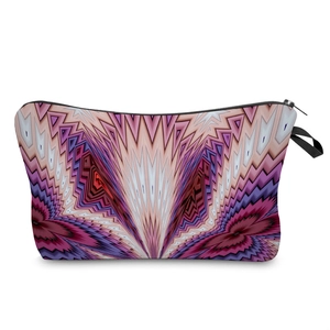 Detail of colorful geometric pattern cosmetic bag with black zipper and side wrist strap