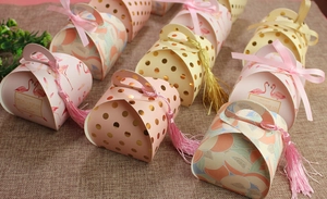 Close-up of European style candy boxes with silk ribbons and decorative tassels