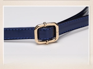 Detail of adjustable dark blue leather strap with premium gold square metal buckle