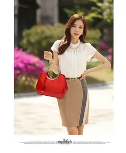 Glossy red patent leather bag with a distinctive golden round metal handle for women