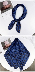 Detail of navy plaid silk scarf with orange polka dots on stylish magazine background