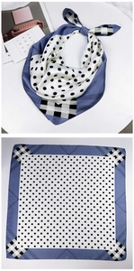 Detail of square silk scarf with elegant blue and white polka dot and plaid patterns