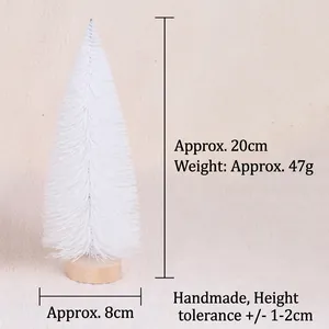 Detailed view of 20cm white mini Christmas tree with snow-dusted needles and wooden base