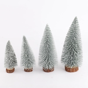 Set of four mini artificial green Christmas trees with snow effect and wooden bases