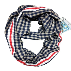 Detailed top-down view of blue and beige plaid cashmere scarf with soft woven texture