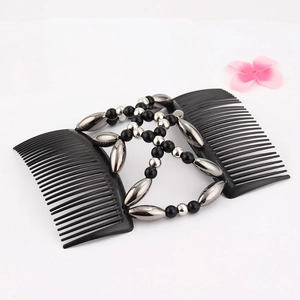Detail view of a double-row magic hair comb with black and gunmetal beads woven network