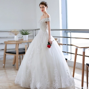 Elegant off-the-shoulder white wedding dress with floral lace embroidery and full tulle skirt