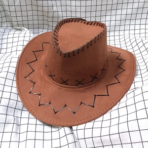 Detail of brown faux suede cowboy hat featuring black cross-stitched seams and air vents