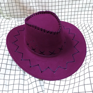 Close-up of deep purple suede cowboy hat with cross-stitch detailing and whipstitched brim