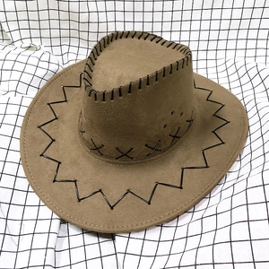 Detail of coffee brown suede cowboy hat with black stitched edges and metal air vents