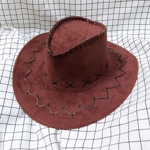 Detail of dark brown faux suede cowboy hat with thick black stitching and metal vents