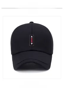 Detail of black baseball cap featuring a SPORT leather patch with silver metal rivets