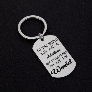 Polished stainless steel Mother's Day keychain with sentimental engraving on black background