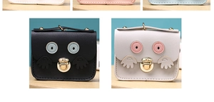 Detail of owl coin purses showing metal twist locks and leather texture in black and white