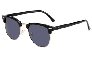Detailed side view of vintage Clubmaster sunglasses with black frame and gold metal accents