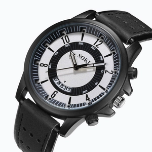 Macro detail of SOKI men's watch featuring a black dial and date window on white background