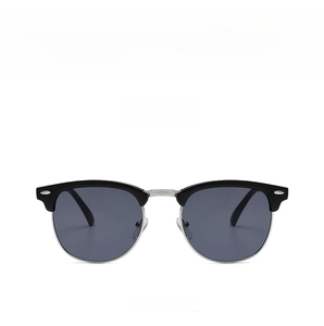 Detail of vintage semi-rimless sunglasses featuring black silver frame and gray lenses