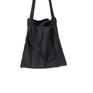 Minimalist black canvas tote bag with long straps for versatile daily shoulder carry