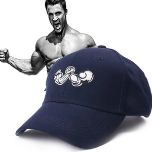 Detail shot of navy blue baseball cap with white arm-wrestling embroidery and fine stitching