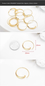 Detail showing 22mm gold minimalist crescent hoop earrings with high polish metallic finish