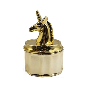 Macro detail of golden ceramic jewelry jar with 3D unicorn head lid and textured finish