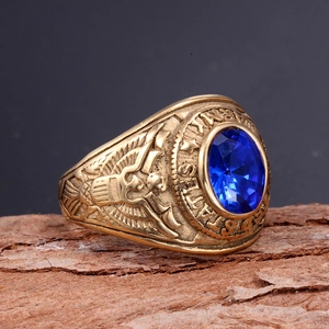 Macro detail of vintage eagle seal ring with large blue oval gemstone and gold relief