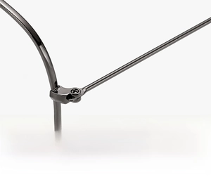 Detailed close-up of a durable gunmetal grey metal hinge on stylish eyeglass frames