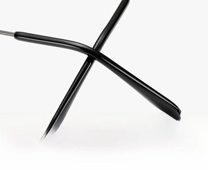 Detail of ergonomic curved temple tips on black metal glasses for anti-slip comfort