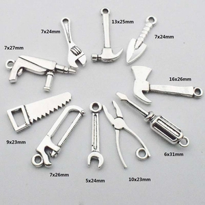 Set of 10 miniature silver alloy tool pendants including hammer saw and wrench for DIY