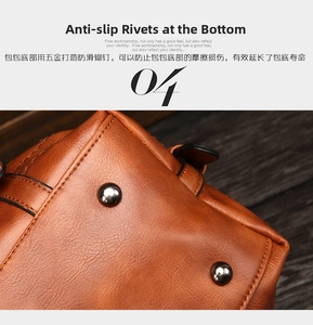 Detail of the brown leather Boston bag base featuring protective metal feet studs