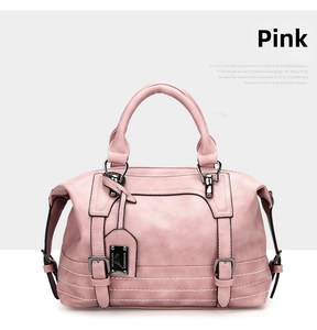 Detail view of pink PU leather Boston bag showing white stitching and metal buckles