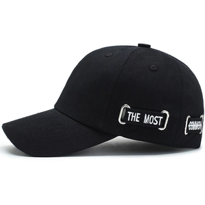 Black cotton baseball cap with side metal rings and THE MOST white embroidered strap