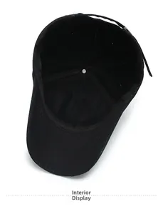 Detailed interior view of a black cotton baseball cap showing stitching and inner structure