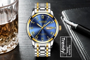 Detail of blue sunray dial quartz watch with two-tone steel strap and calendar display
