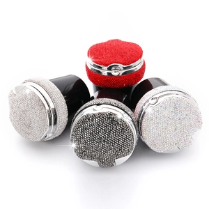 Set of five rhinestone-encrusted car air vent perfume clips in various vibrant colors