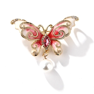 Broche papillon dorée avec ailes en émail rouge, strass étincelants et perle blanche
